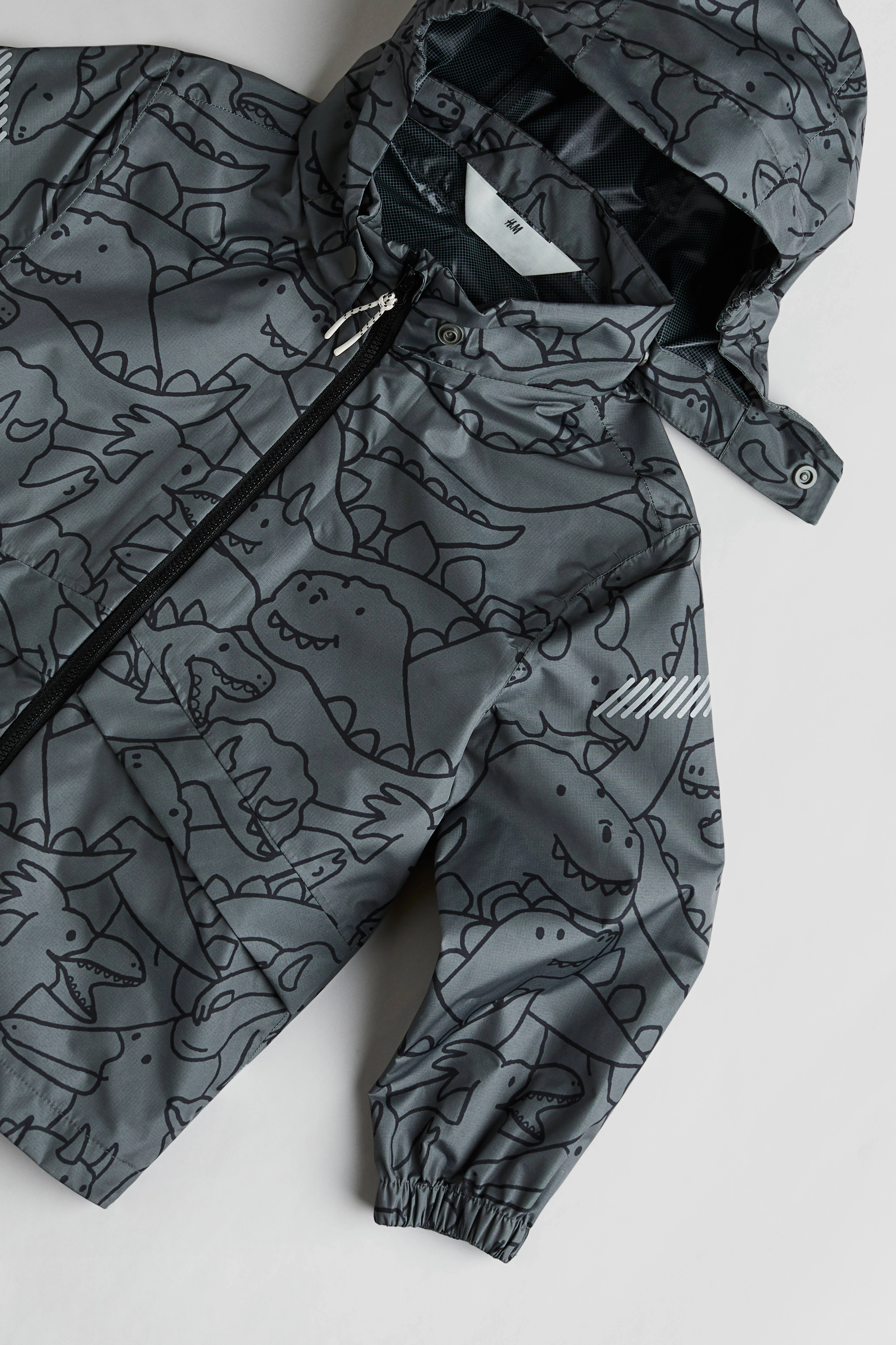 Rain jacket - Dark grey/Dinosaurs - Kids | H&M GB