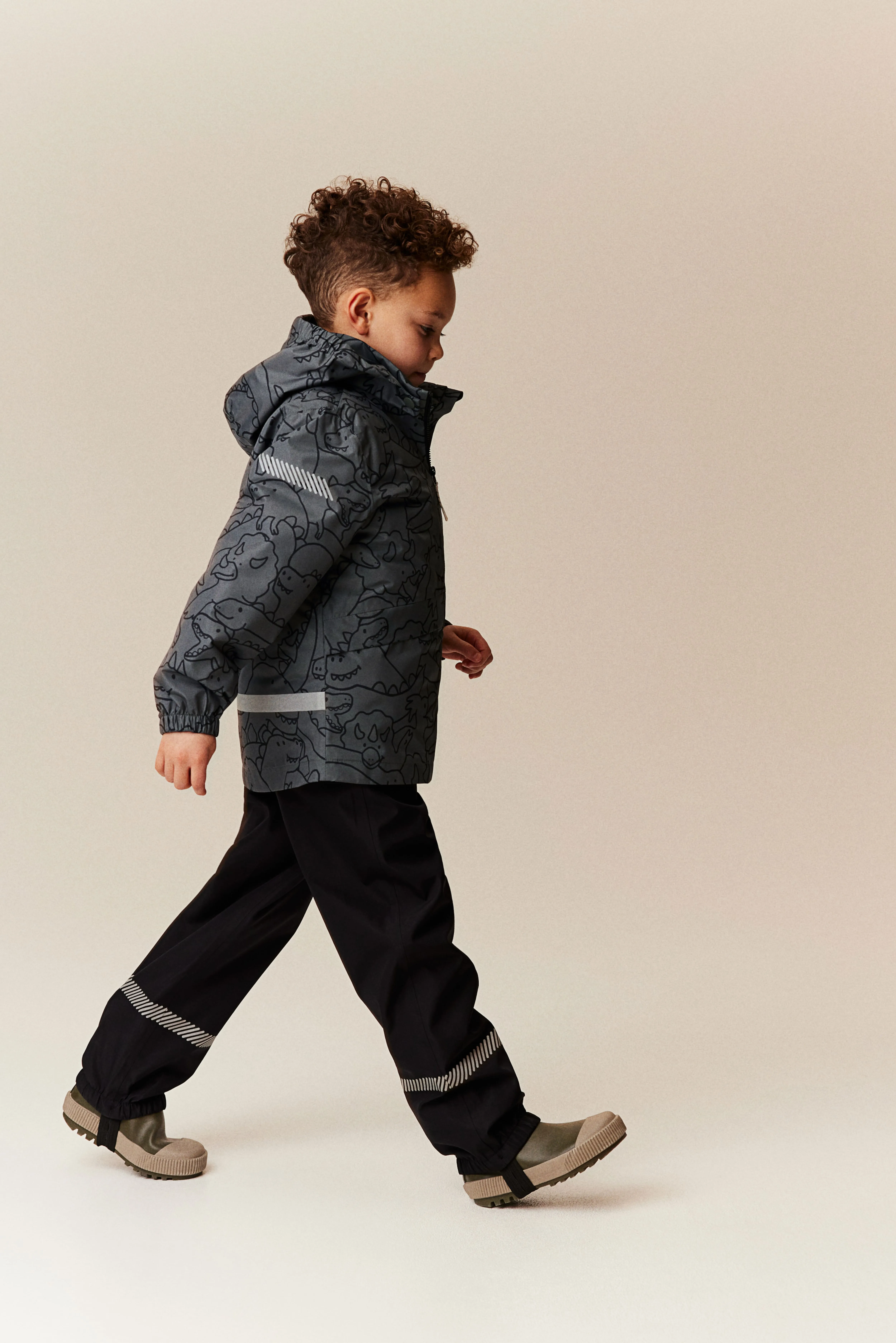 Rain jacket - Dark grey/Dinosaurs - Kids | H&M GB